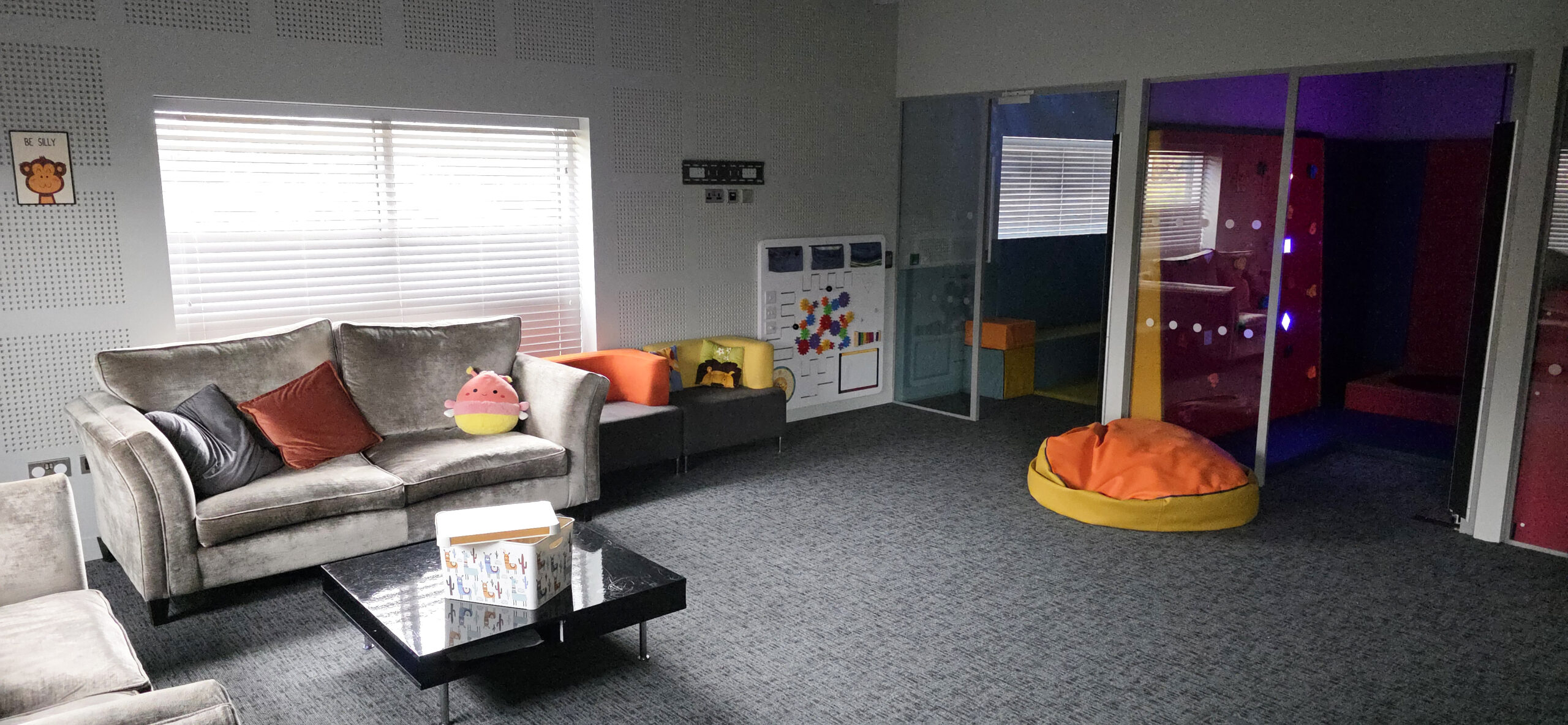 Explorium's accessible sensory room with comfortable seating