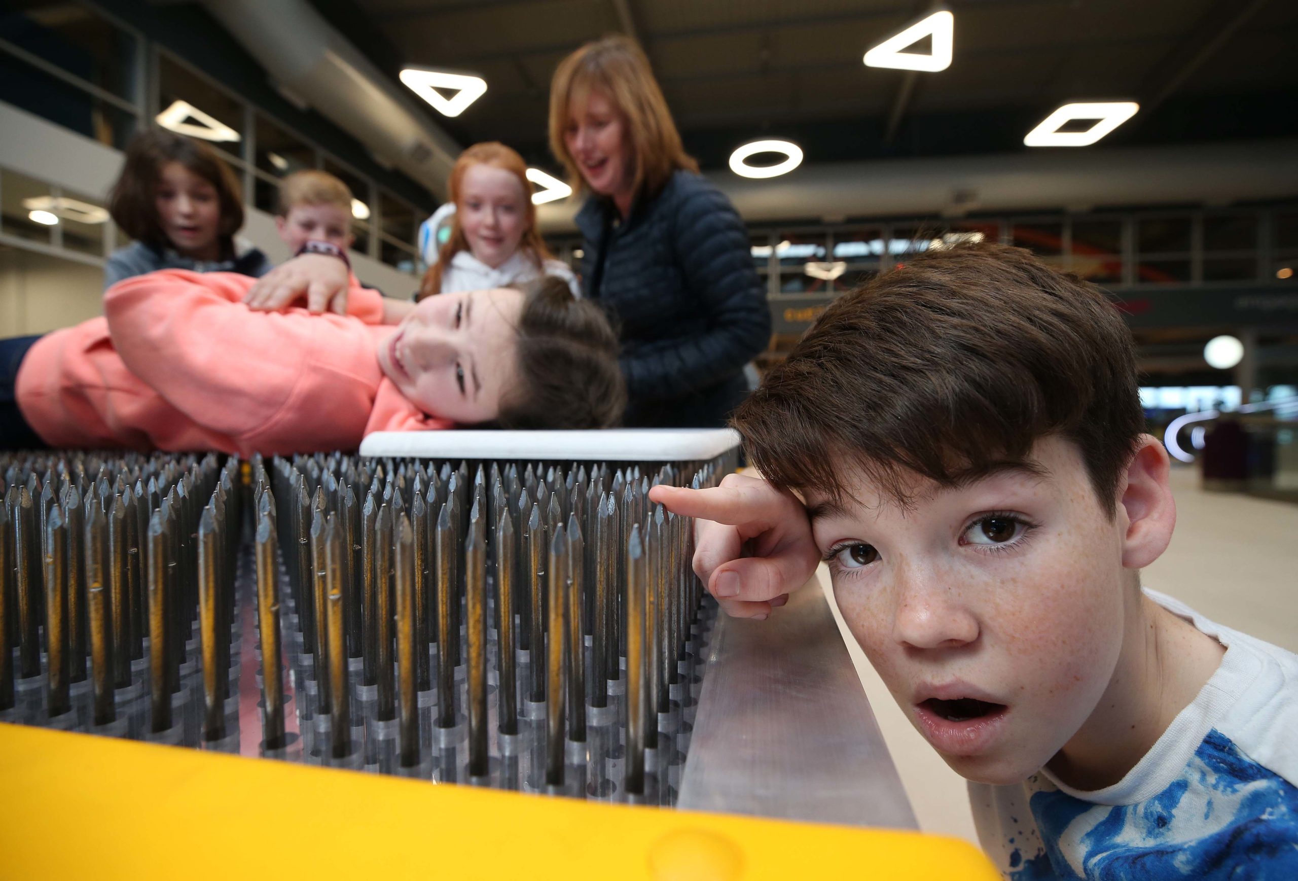 Family with bed of nails exhibit_three